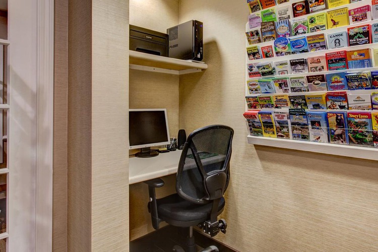 Desk, desktop, chair and printer in business center