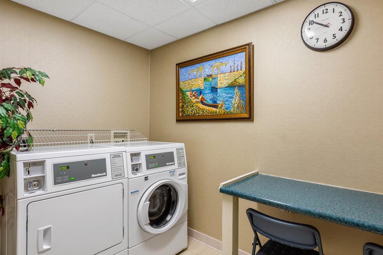 Washer and dryer beside folding table