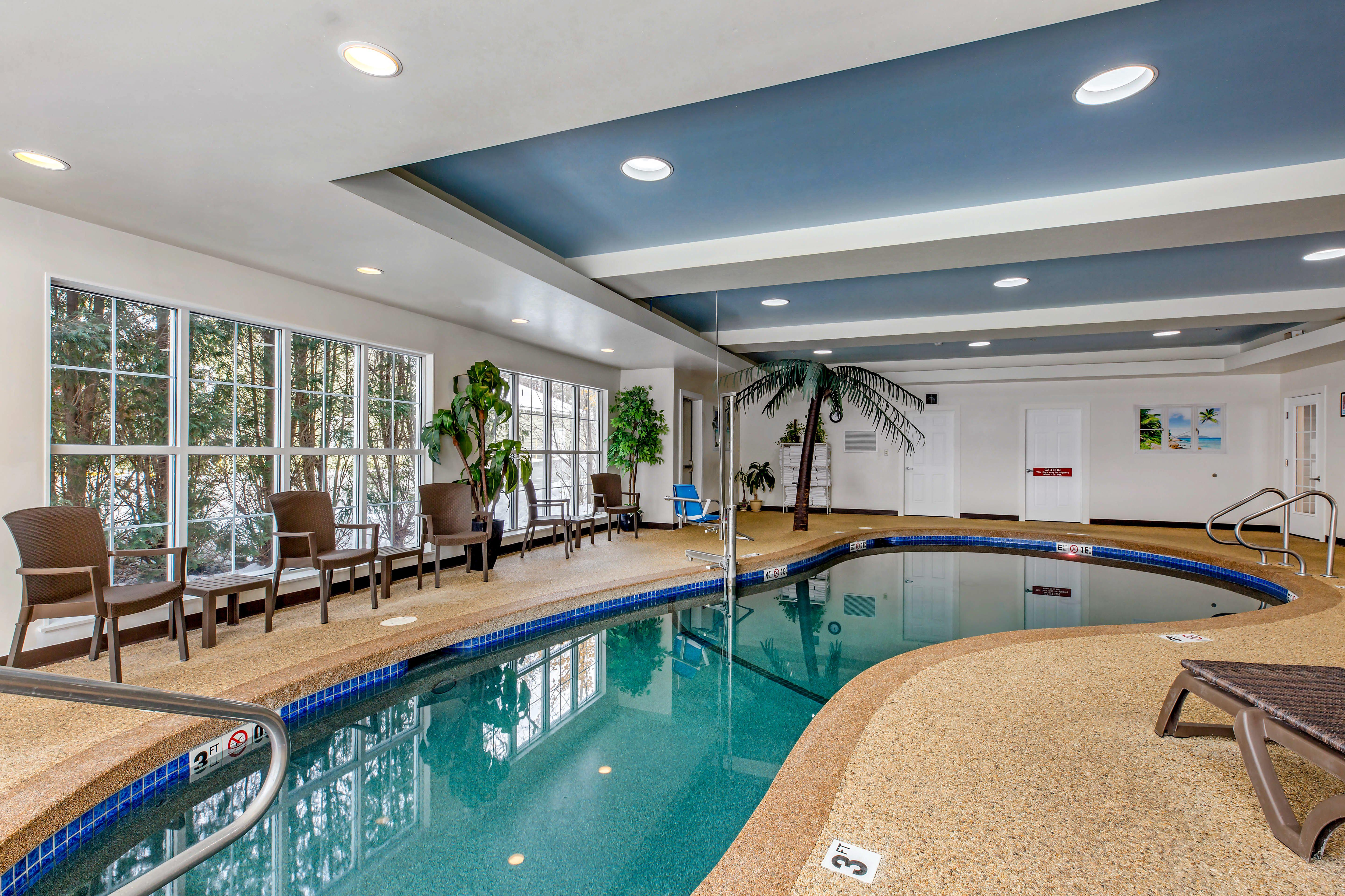Indoor pool area with lounge area