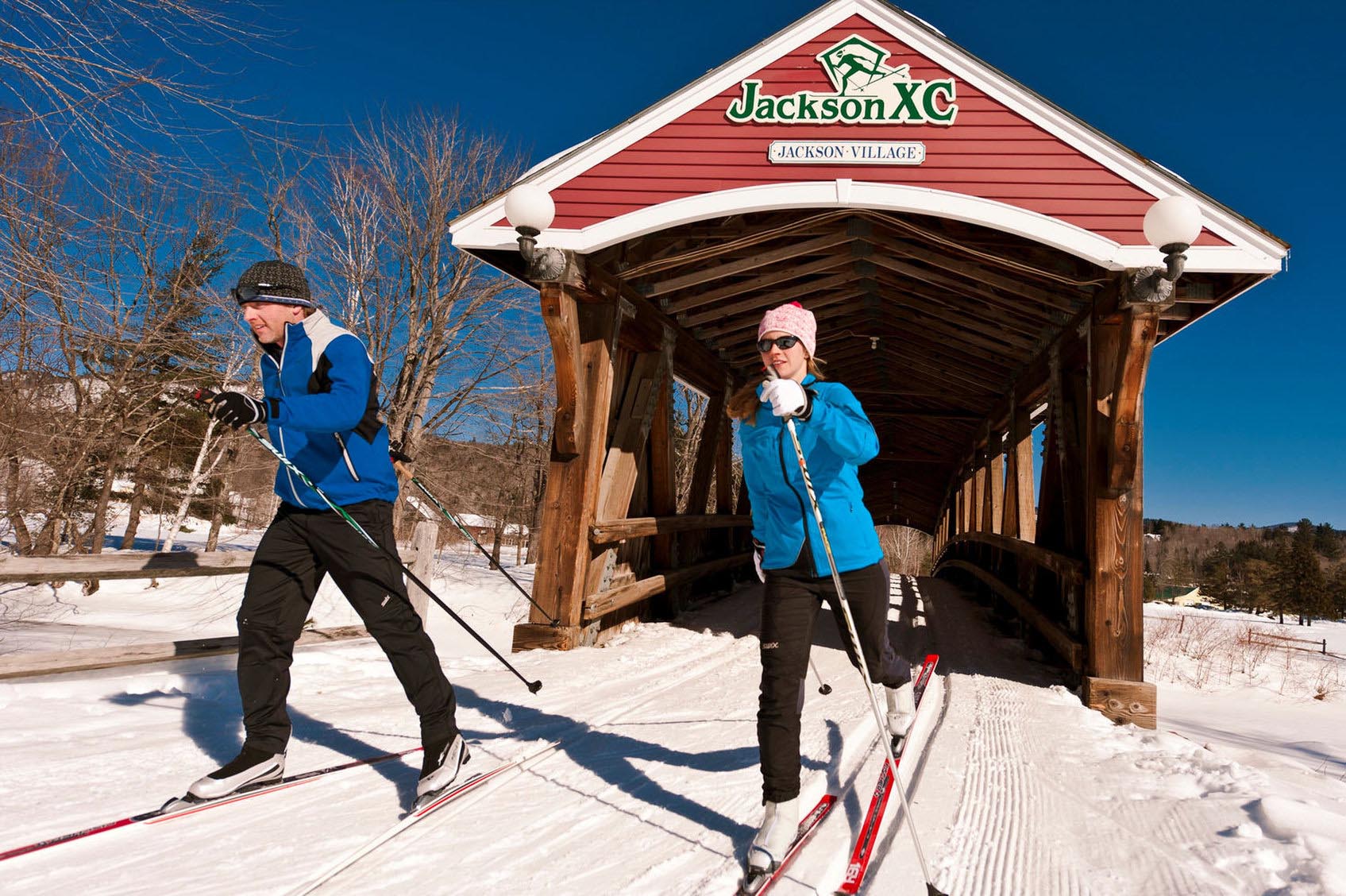 Man and woman cross country skiing 